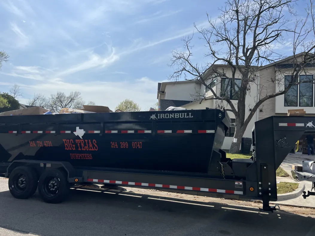 Professional dumpster service on residential street